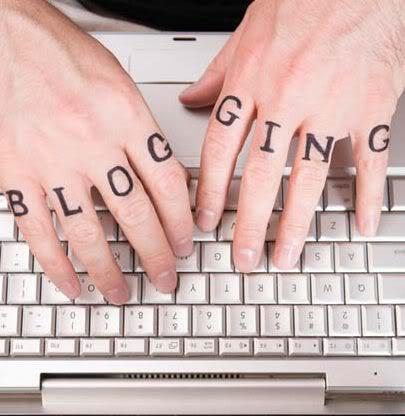 The potential of Bloggin online Fingers type on keyboard with the letters blogging on each finger