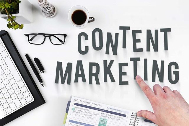 Words content marketing in black on white background with laptop Words content marketing in black on white background with laptop