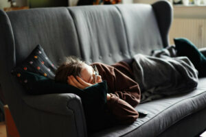 Man lying on the couch not doing the Work. Wondering What is Affiliate Marketing So Hard Man lying on the couch not doing the Work. Wondering What is Affiliate Marketing So Hard