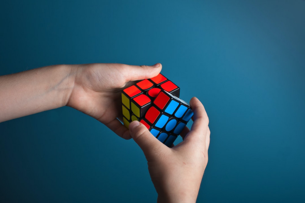 Person Solving Problems with a Rubix Cube