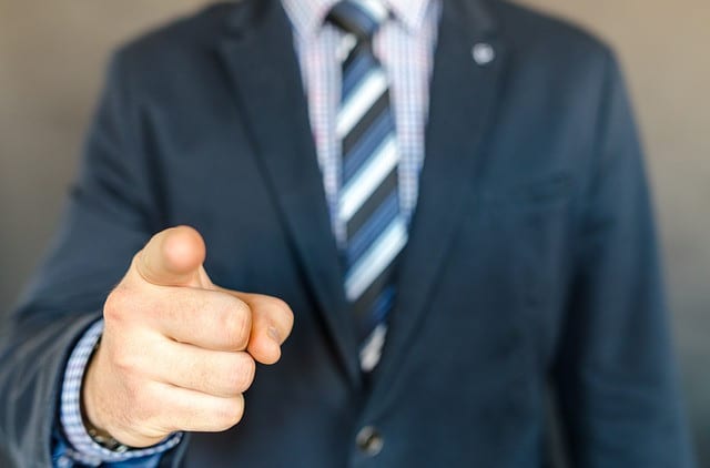 Image of male pointing his finger at you.